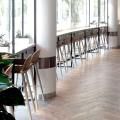 Cafe Aster - Gardens by the Bay | Product Seen: [Troy Barchair - SH650 & Customised laminated tabletop + FLAT® KX22-H1035 Table Base (For Bar Table)]